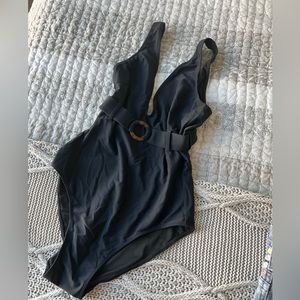 Black one piece bathing suit.